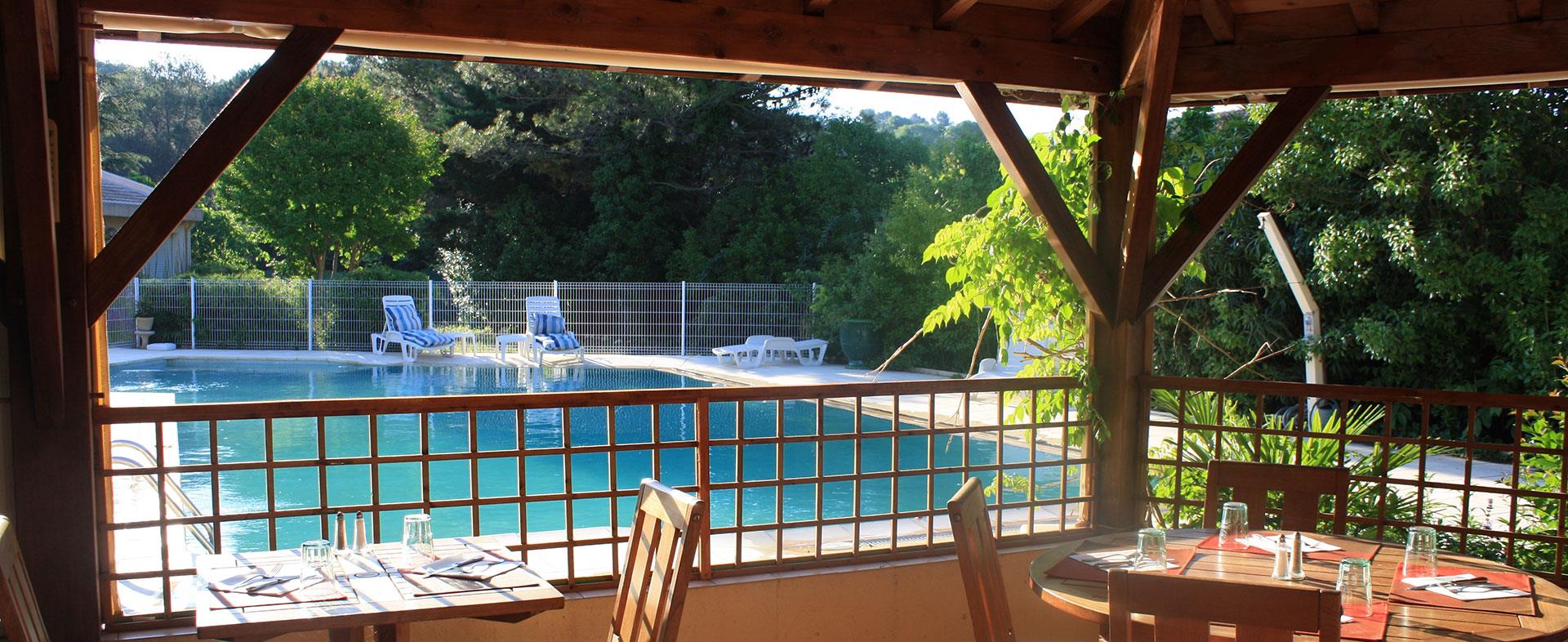 View across the pool from the terrace of the hotel Saint Benoit located in Hérault